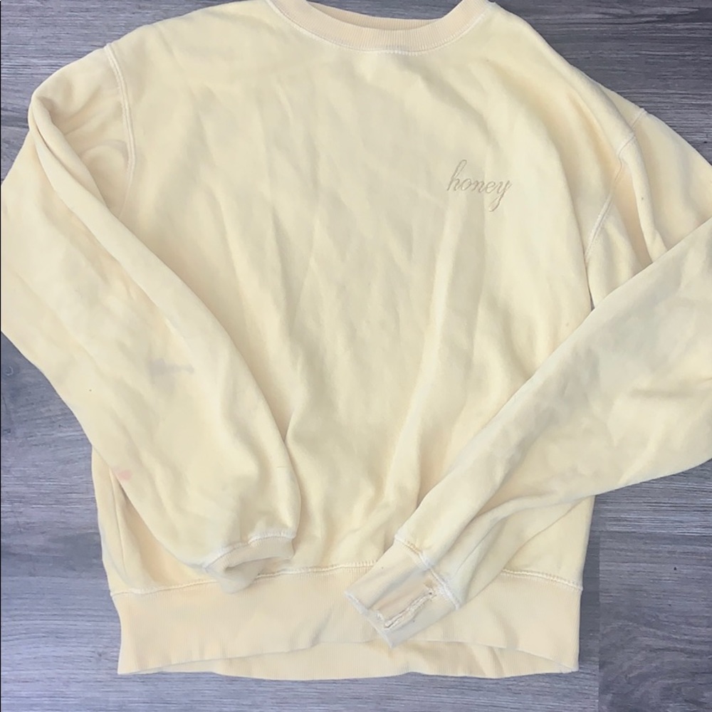 pretty worn in, yellow crew neck